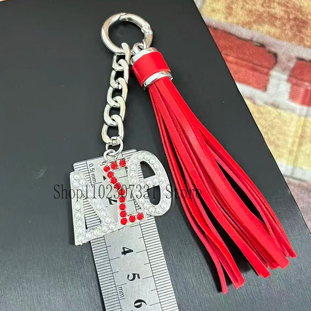 Stainless Steel Greek Letter Delta Shield Keychain With Red Tassel by Passport Outfitters